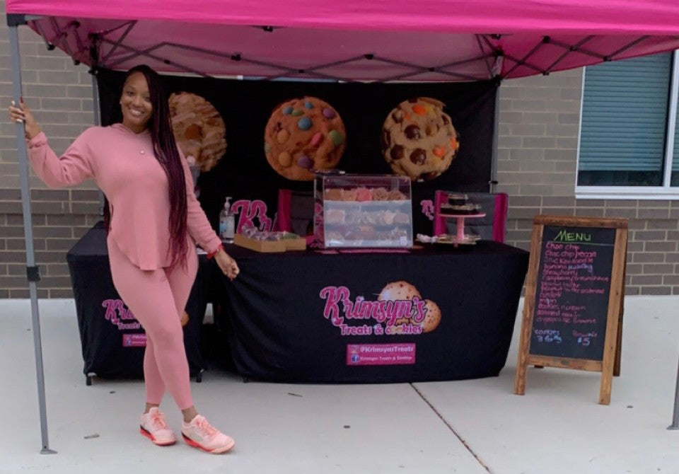 Andrea pictured at her Krimsyn's Treats & Cookies booth